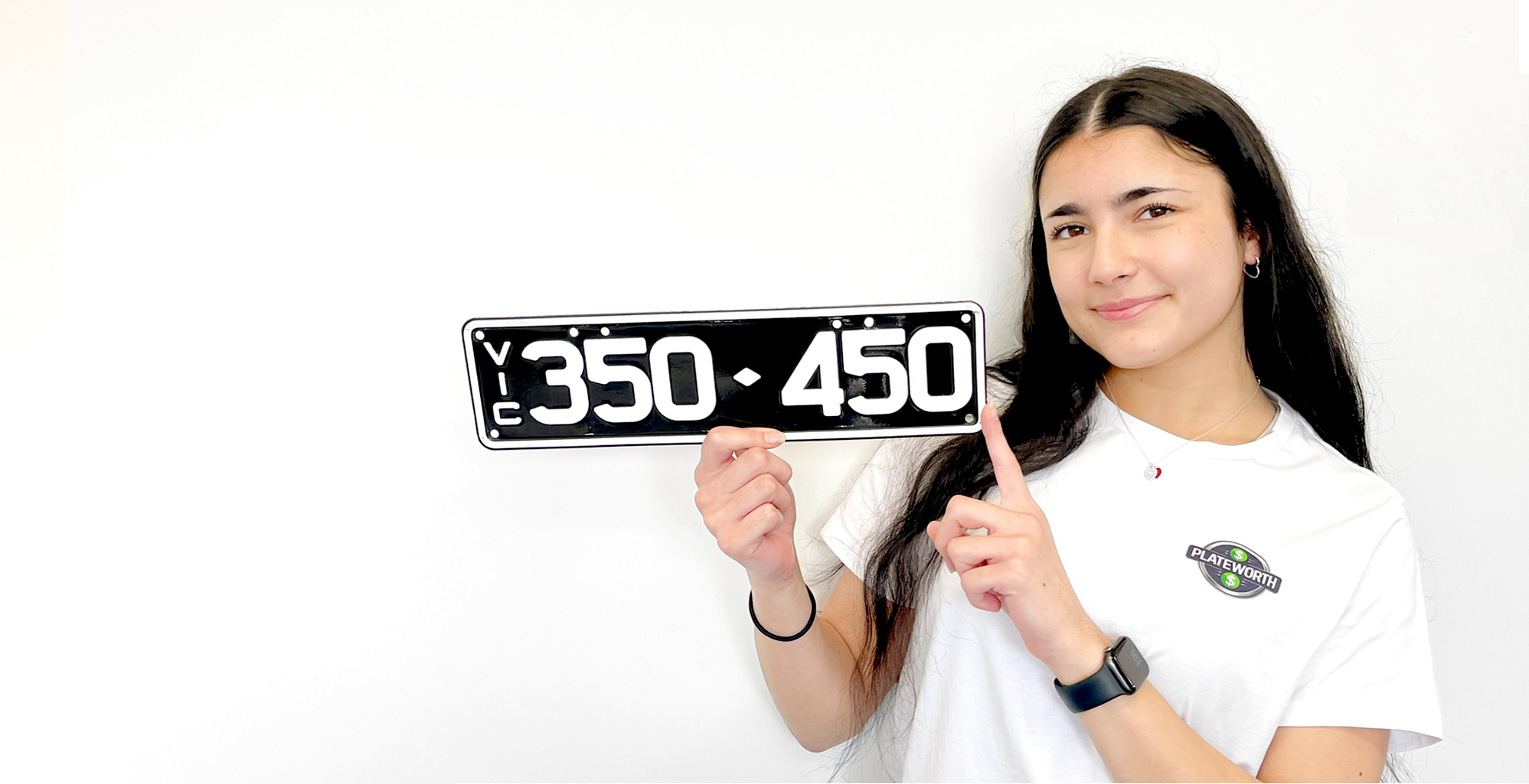 PlateWorth user holding a custom licence plate